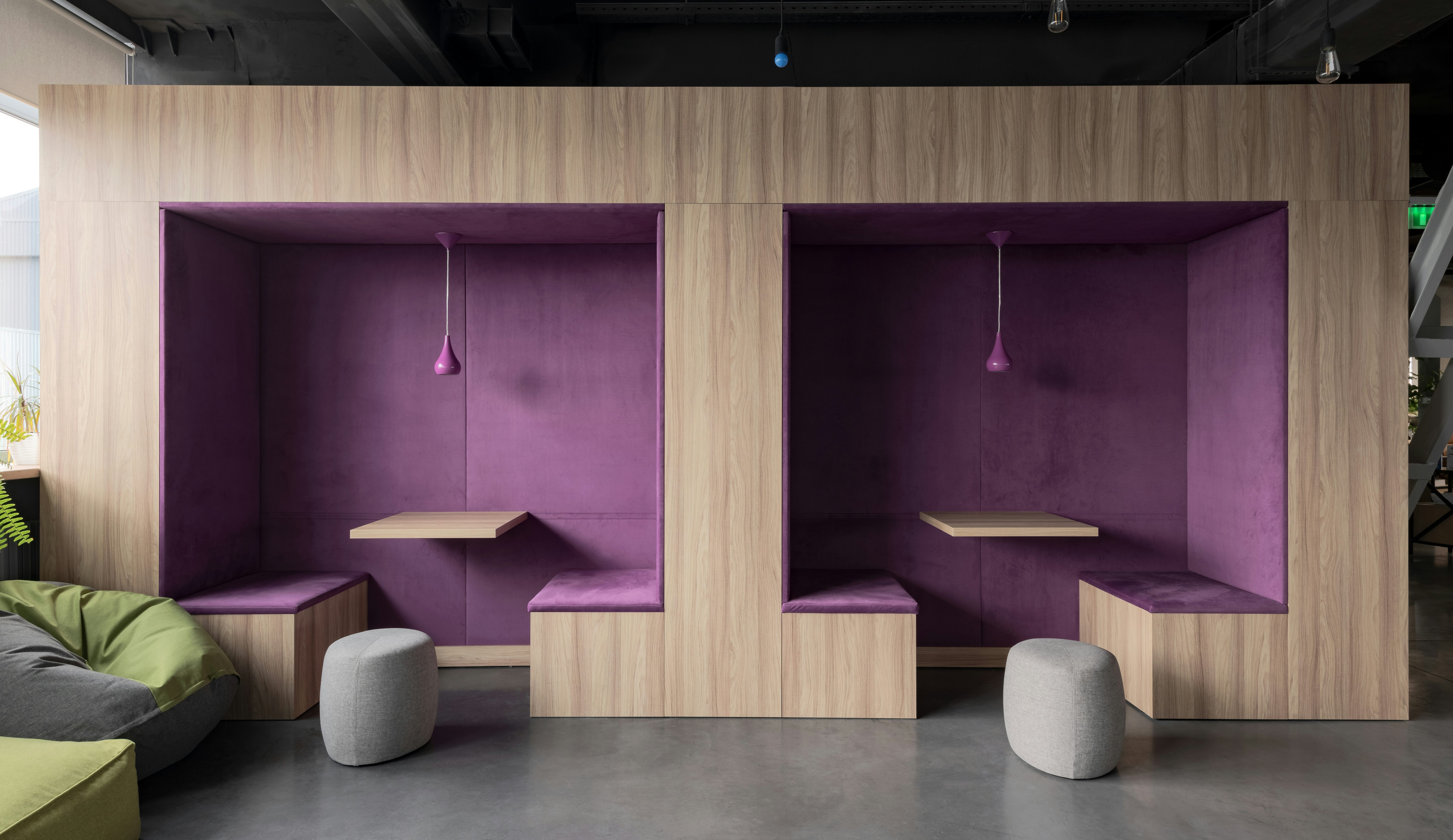 Modern workspace with purple booth seating